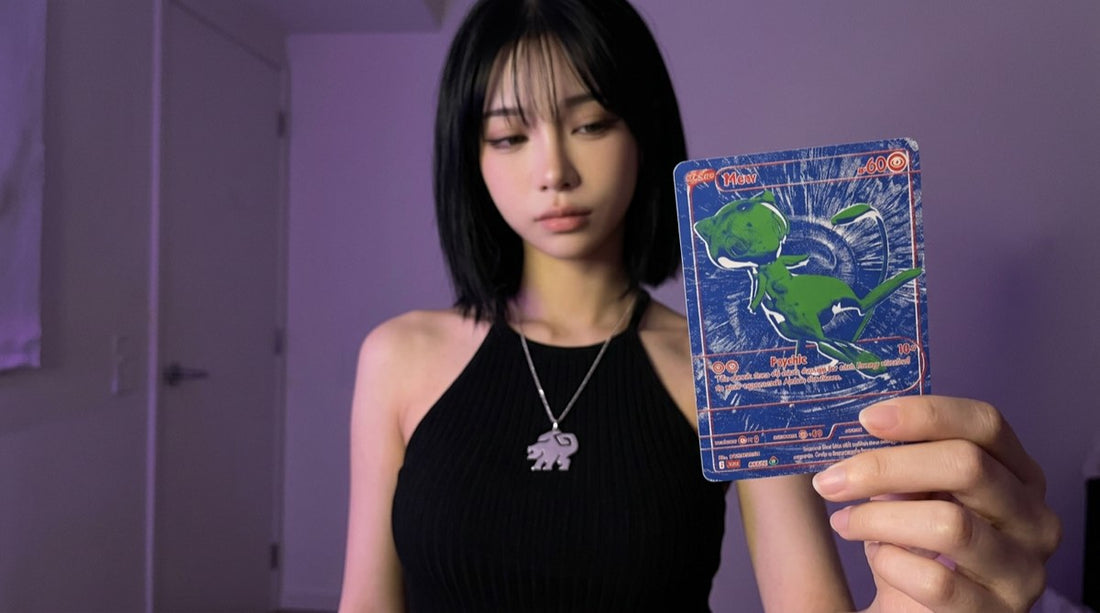 Evol Vault content host Alice holding the blue B/RGB Mew RGB Rare card from Pokemon 30th Celebration
