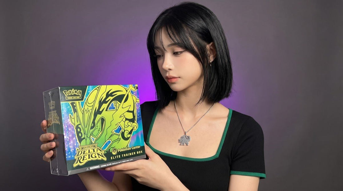 Evol Vault content host Alice holding the Pokemon Delta Reign Pokemon Center Elite Trainer Box with its Mega Rayquaza artwork