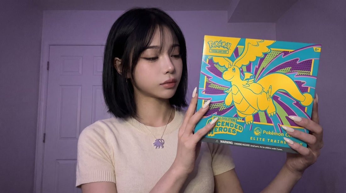 Evol Vault content host Alice holding the Ascended Heroes Pokemon Center Elite Trainer Box