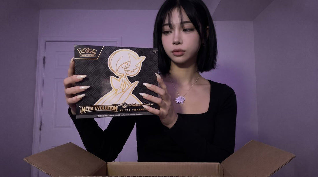 Evol Vault content host Alice holding the Mega Evolution Pokemon Center Elite Trainer Box above an open shipping box