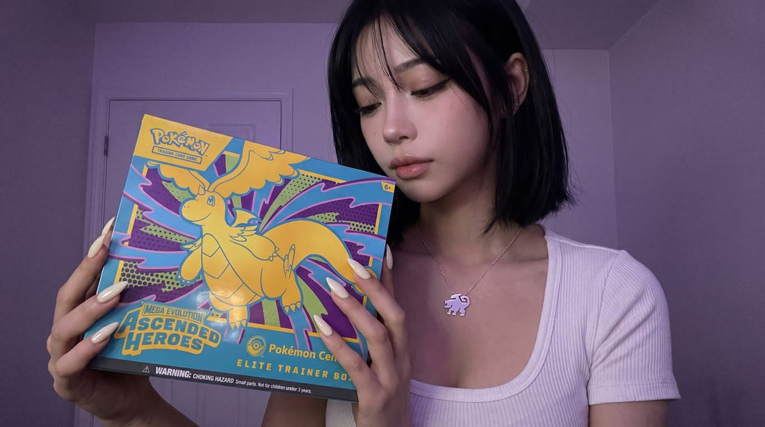 Evol Vault content host Alice holding the Ascended Heroes Pokemon Center Elite Trainer Box