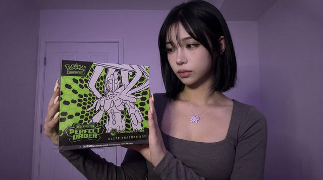 Evol Vault content host Alice holding the Perfect Order Pokemon Center Elite Trainer Box